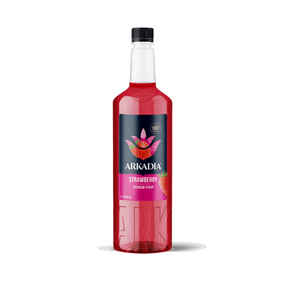 Red bottle of Arkadia strawberry syrup on a white background