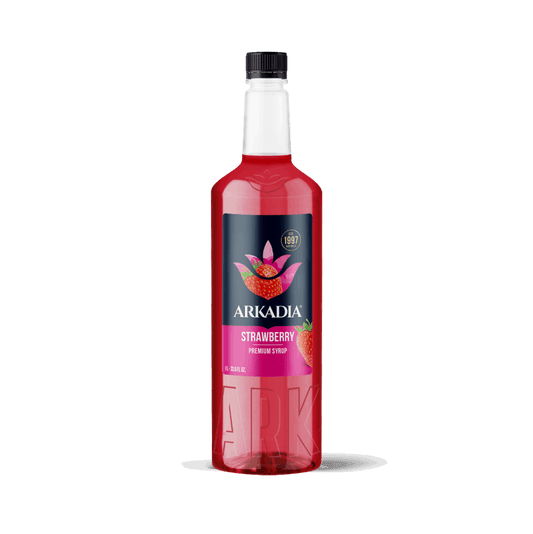 Red bottle of Arkadia strawberry syrup on a white background