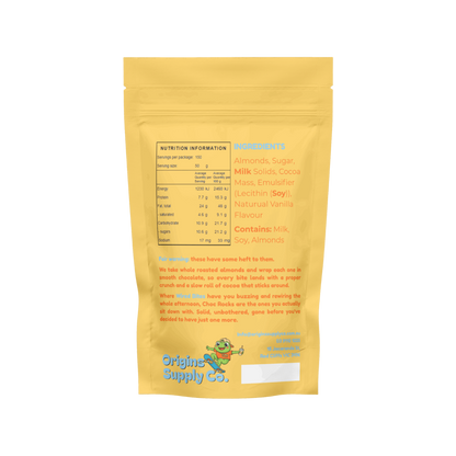 A yellow stand-up pouch of Origins Supply Co. chocolate-covered almonds, showing the back side of the packaging with nutritional information, ingredients list, and a cartoon mascot on a white background.