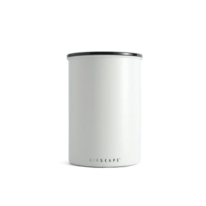 White cylindrical container with black rim on a white background
